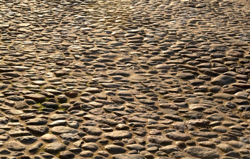 Preview: Cobblestone Sidewalk Made Of Small Stones At Sunny Day.