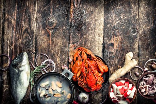 Preview: Different Seafood On Table. On A Wooden Background.