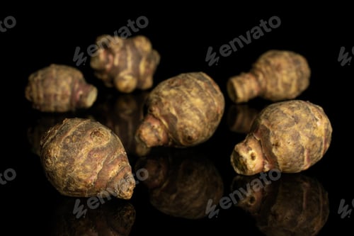 Preview: Group Of Six Whole Fresh Brown Jerusalem Artichoke Isolated On Black Glass