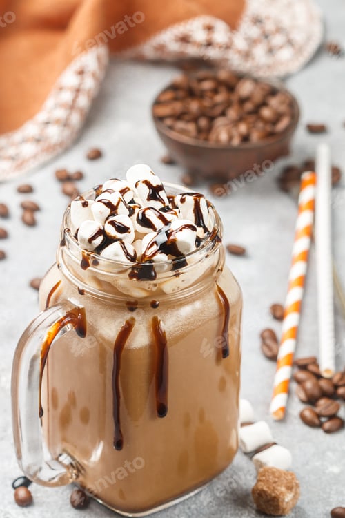 Preview: Iced Coffee With Marshmallows And Chocolate Syrup In A Mason Jar On A Grey Concrete Background