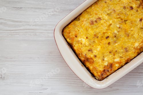 Preview: Homemade Cheesy Amish Breakfast Casserole On A White Wooden Table, Top View. Flat Lay, Overhead