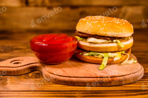 Preview: Hamburger And Sauce On Rustic Wooden Table