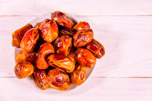 Preview: Date Fruits On A White Wooden Table. Top View