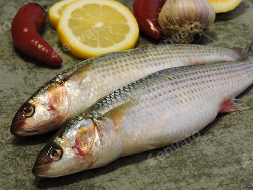 Preview: Mullet. Two Raw Fish And Lemon.