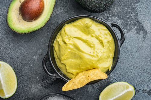 Preview: Guacamole Freshly Cooked And Served In Bowl, On Gray Background, Top View Or Flat Lay