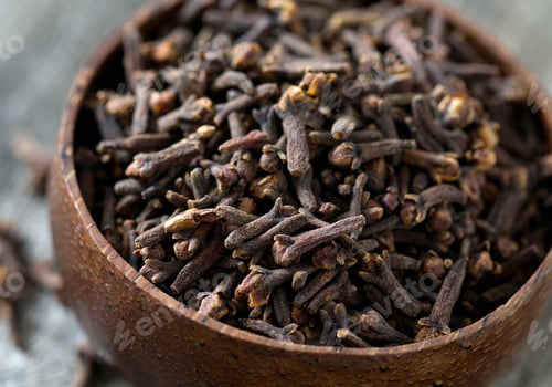 Preview: Cloves In A Bowl On Wooden Surface