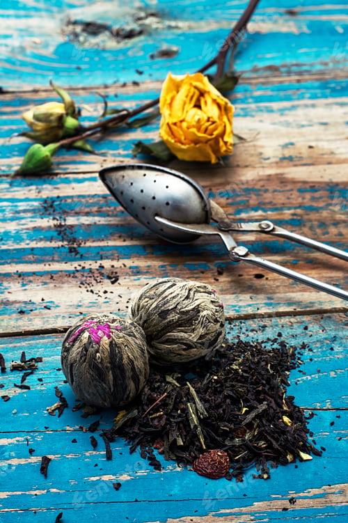 Preview: Tea Leaves For Brewing,Tea Spoon And Dried Yellow Rose.The Image Is Tinted In Vintage Style