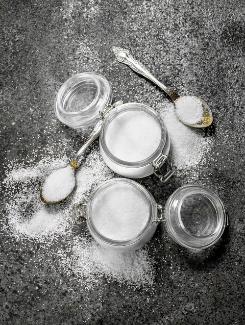 Preview: Salt In Jars And Spoons. On Rustic Background.