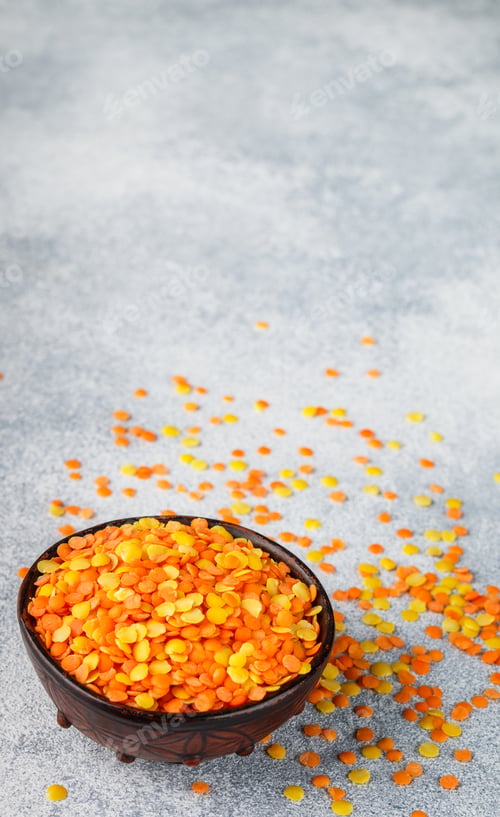 Preview: Assortment Of Dry Multicolored Lentils In A Clay Bowl Close-Up. Yellow And Red Cereals. Variety Of