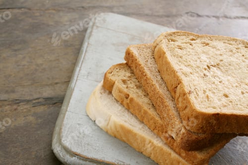Sliced Bread on a Wooden Cutting Board