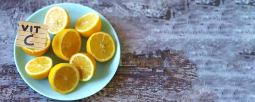 Preview: Selective Focus. Note With The Inscription Vit C In A Plate With Lemons. Lemons As A Source Of