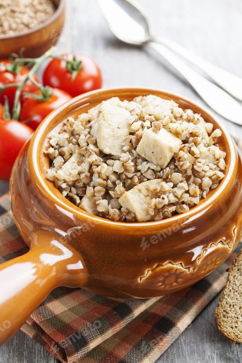 Preview: Buckwheat Porridge With Meat In A Ceramic Pot On The Table