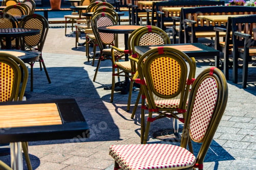 Preview: Chairs And Tables In Cozy Street Cafe