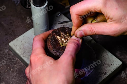 Preview: Jeweller Engraves Golden Trident. Trident Is A Symbol Of Ukraine