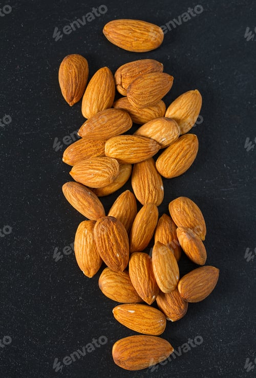 Preview: Almonds On Black Surface