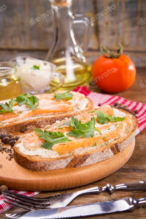 Preview: Sandwich With Red Fish And Fresh Parsley On Wooden Background