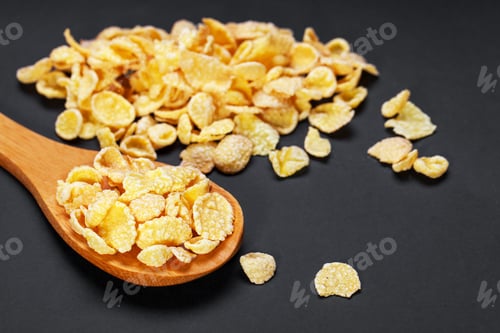 Preview: The Glazed Flakes In A Glass Dish Are Isolated On A Black Background