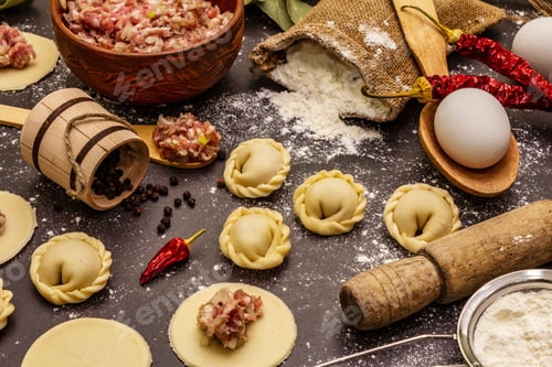 Preview: Composition With Raw Dumplings And Ingredients On Trendy Black Stone Concrete Background. Process