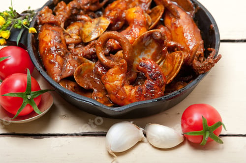 Preview: Fresh Seafood Stew Prepared On An Iron Skillet Ove White Rustic Wood Table
