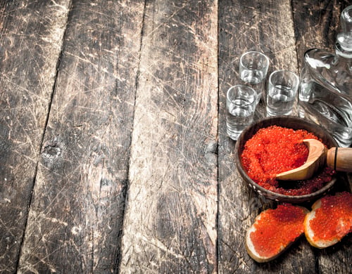 Preview: Vodka With Red Caviar. On Wooden Background.