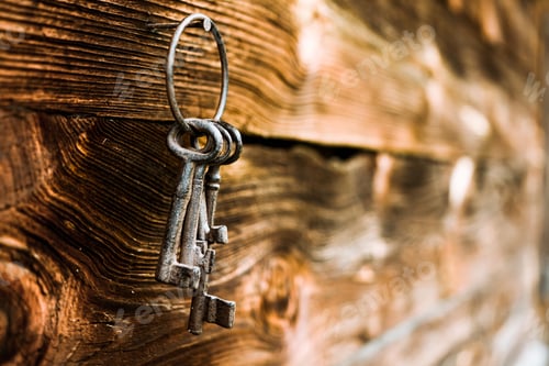 Preview: Bunch Of Rusty Keys Hanging On A Nail On Wooden Wall Background. Vintage Style