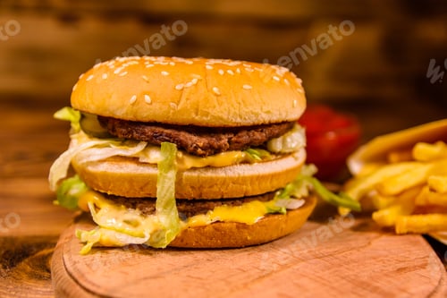 Preview: Hamburger And French Fries On Rustic Wooden Table