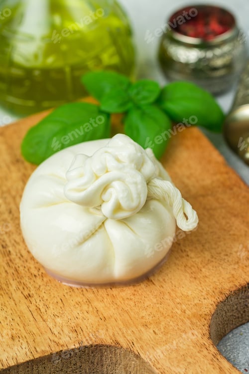 Preview: Burrata. Italian Delicacy Soft Cheese (Mozzarella And Strachatella) With Olive Oil, Fresh Basil