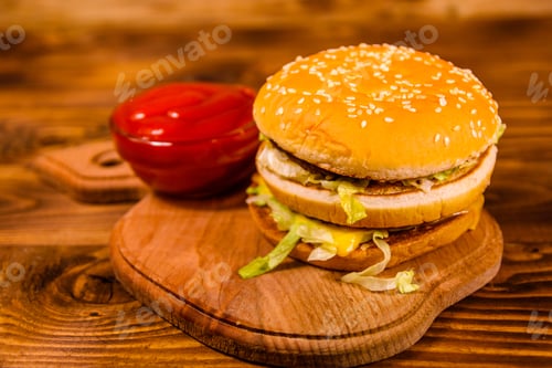 Preview: Hamburger And Sauce On Rustic Wooden Table