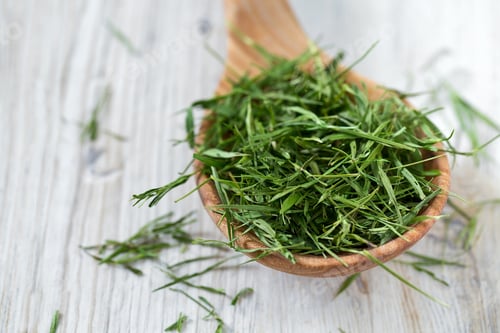 Preview: Wooden Spoon Filled with Fresh Green Herbs