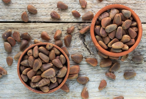 Preview: Brown Siberian Pine Nuts On Wooden Table