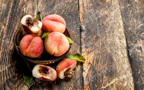Preview: Fresh Peaches In A Bowl. On A Wooden Background.