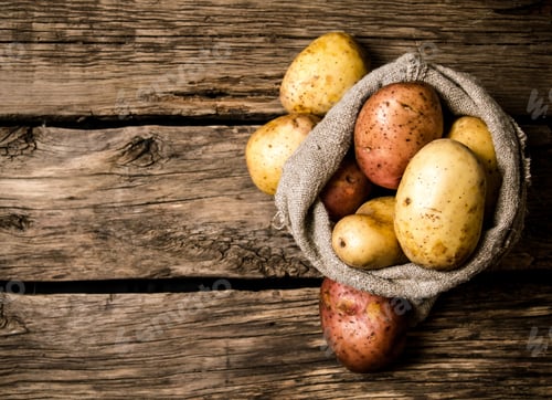 Preview: Raw Potato Food . Fresh Potatoes In An Old Sack On Wooden Background. Free Place For Text. Top View