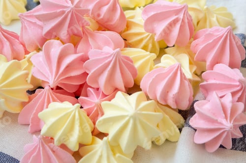 Preview: Mini Meringues On Striped Napkin, Side View. Close-Up.