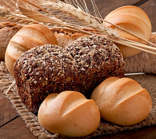 Preview: Assortment Of Baked Bread On A Wooden Table