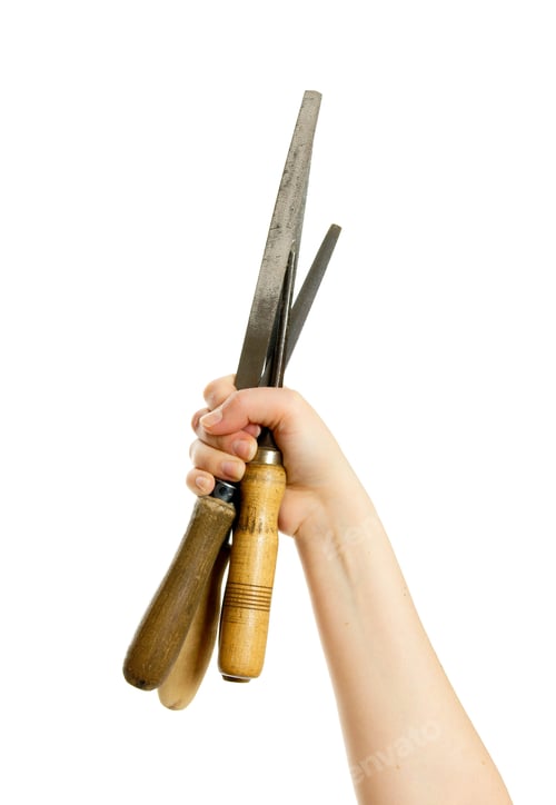Preview: Working Tools. File In A Hand On A White Background.