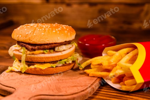 Preview: Hamburger And French Fries On Rustic Wooden Table