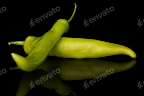 Preview: Group Of Two Whole Hot Green Pepper Banana Isolated On Black Glass