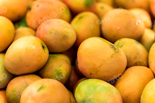 Preview: Close Up Of Fresh Mangos At Food Street Market. Juicy Mango Fruit Background