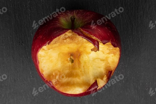 Preview: One Whole Bitten Fresh Apple Red Delicious Flatlay On Grey Stone