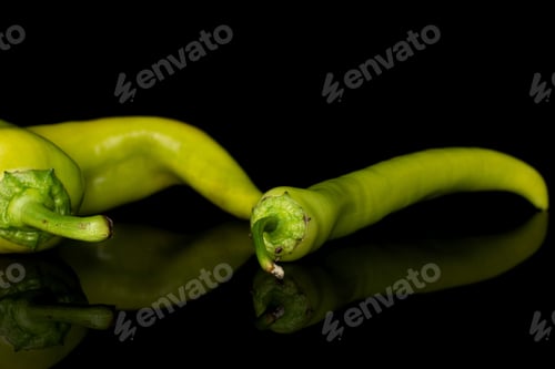 Preview: Group Of Two Whole Hot Green Pepper Banana Isolated On Black Glass