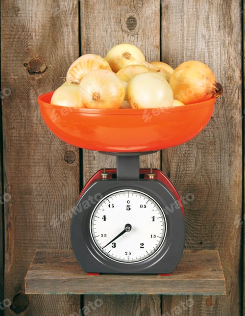 Preview: Onions On Scales On A Wooden Shelf.