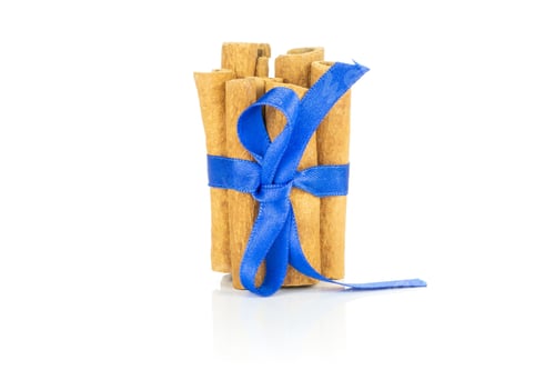 Preview: Lot Of Whole Dry Brown Cinnamon Stick Tied By Electric Blue Silk Ribbon Tied By Ribbon Isolated On