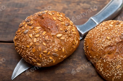 Preview: Fresh Organic Bread Over Rustic Table Macro Closeup