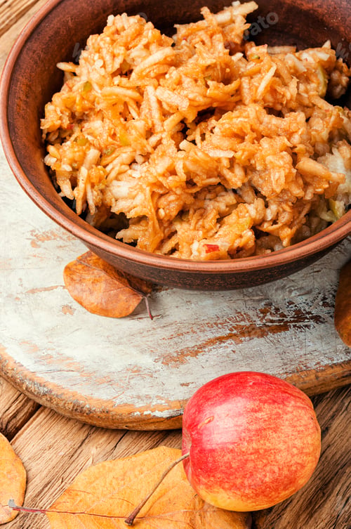 Preview: Grated Ripe Autumn Apples In A Plate On A Wooden Old Table