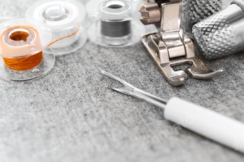 Preview: The Sewing Machine, Threads And Thimbles On A Fabric.