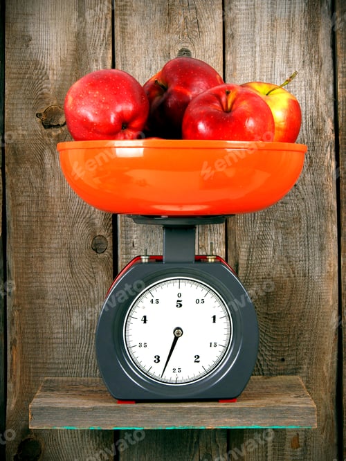 Preview: Apples On Scales On A Wooden Shelf.