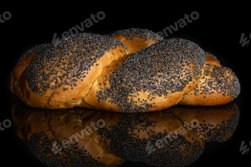 Preview: One Whole Twisted Poppy Seed Bun Isolated On Black Glass