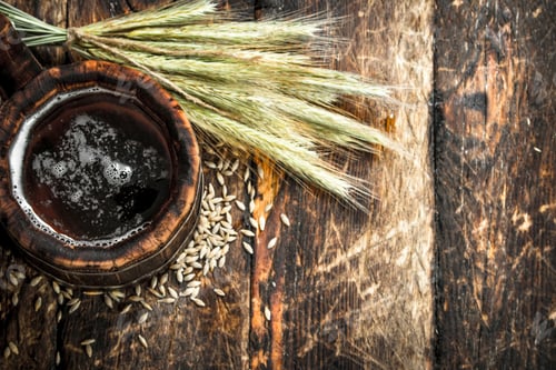 Preview: Fresh Beer In A Wooden Mug. On A Wooden Background.
