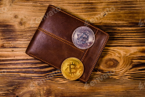Preview: Brown Leather Wallet And Bitcoins On Wooden Background. Top View
