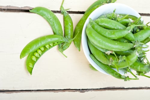 Preview: Hearthy Fresh Green Peas Over A Rustic Wood Table
